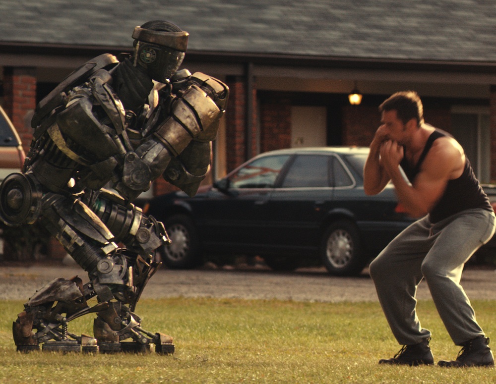 Hugh Jackman shadowboxes Atom in Real Steel